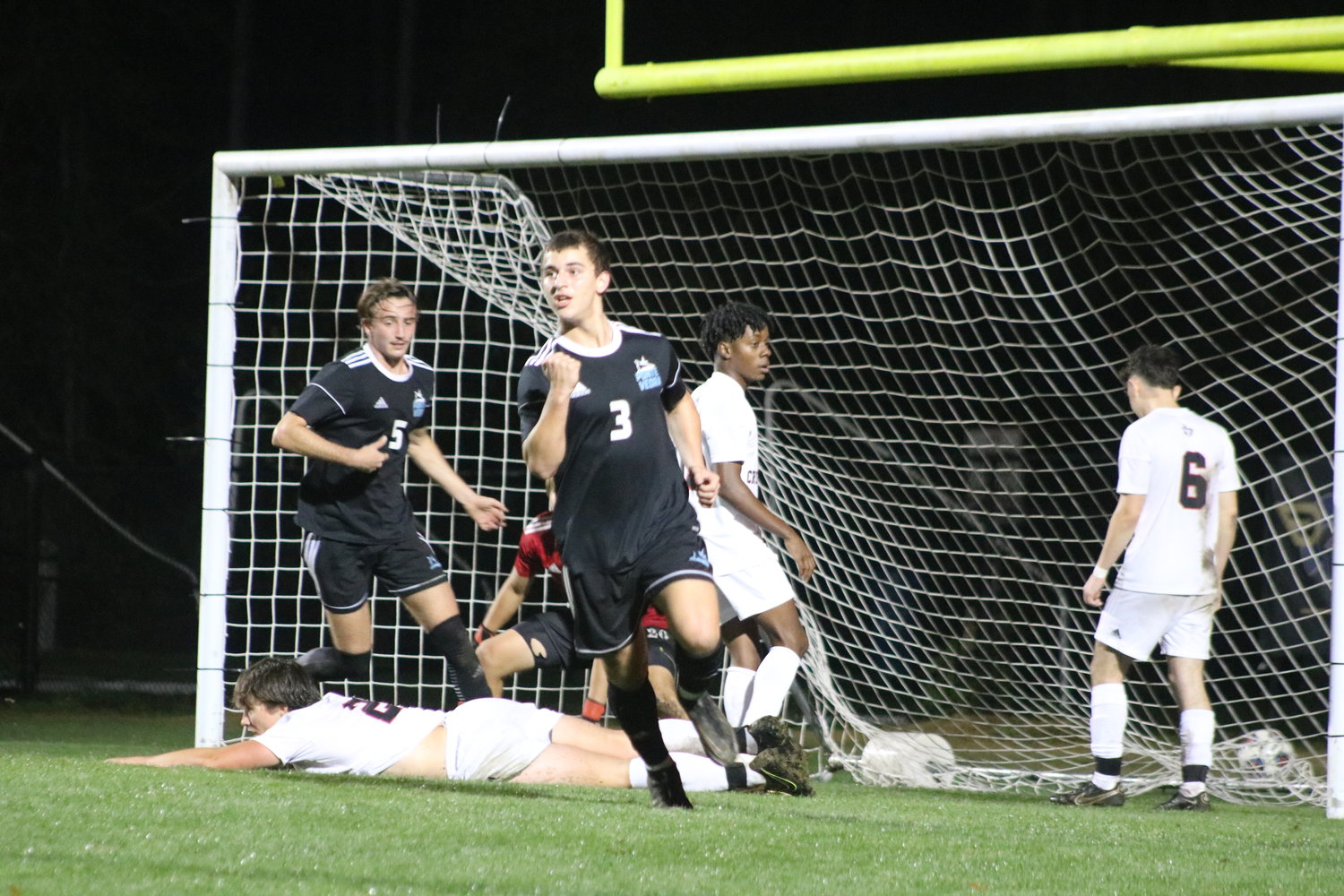 Joey Stephens turns to celebrate with his teammates immediately after scoring a goal against Bishop Kenny Jan. 5.